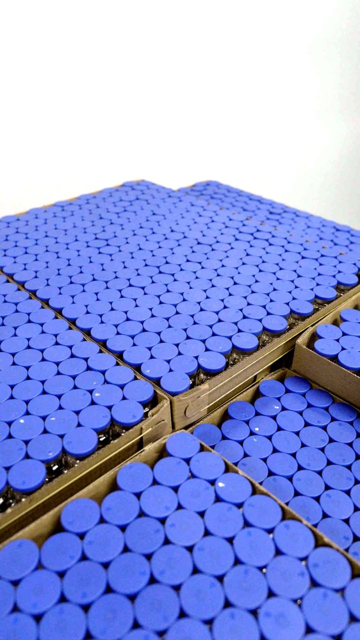 Capped vials in trays after filling